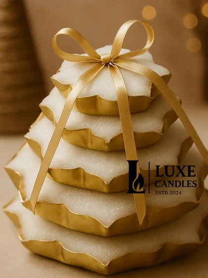 The Noor-e-Luxe, a stack of lotus-shaped urli candles, tied together with a golden ribbon. This makes for a grand and luxurious centerpiece or gift.