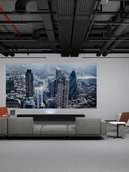 A media lounge concept designed for presentations and informal meetings. The dark, exposed ceiling and minimalist furniture create a cinematic, focused atmosphere, proving that a functional corporate space can also be elegant and comfortable.