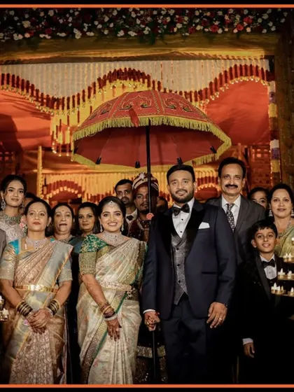 A beautiful family portrait on the reception stage. We make sure to capture these important group photos with all the key family members, framed by the event's grand decor.