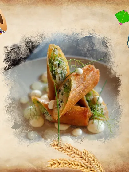 A fusion dish for Baisakhi, these crispy rolls are served with a creamy sauce, blending traditional festival vibes with modern culinary art.