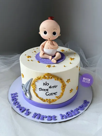 A fun cake for a baby's first haircut or "mundan" ceremony. The cake features a cute, bald baby figurine with a playful "No Hair Don't Care" message.
