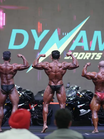 Another angle of the rear lat spread, showcasing the width and density of the back muscles.