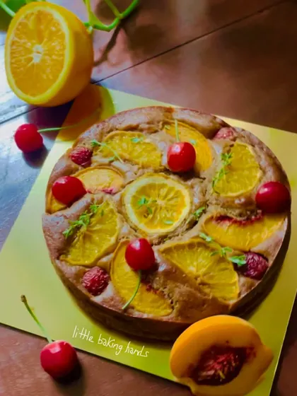 A colourful and summery cake with peach, orange, and cherry. A true celebration of seasonal fruits in one delicious bake.