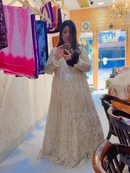 A mirror selfie from a trial session. This full-sleeve golden gown is all about glamour and is perfect for anyone wanting to feel "perfectly golden" at their next event.