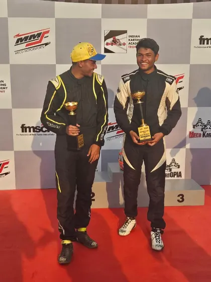 Teammates celebrating on the podium.