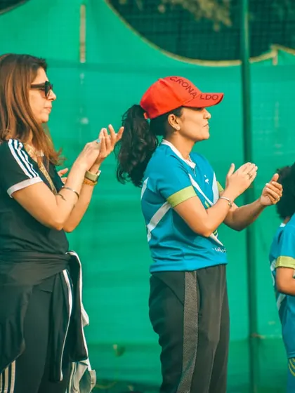 Parents and supporters clapping for the players, creating a positive and encouraging environment.
