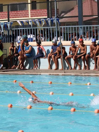 A swimmer cuts through the water, showcasing the speed and excitement of competitive swimming.