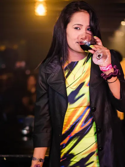 A guest enjoying a glass of wine.