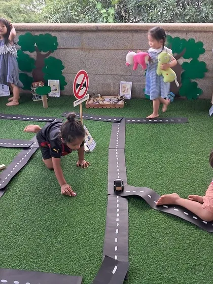 The children collaborate and negotiate as they play, deciding where the cars should go and what happens next in their town. This is social-emotional learning in action.