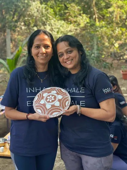 Two students with their beautifully painted plates. A wonderful memory from our retreat.