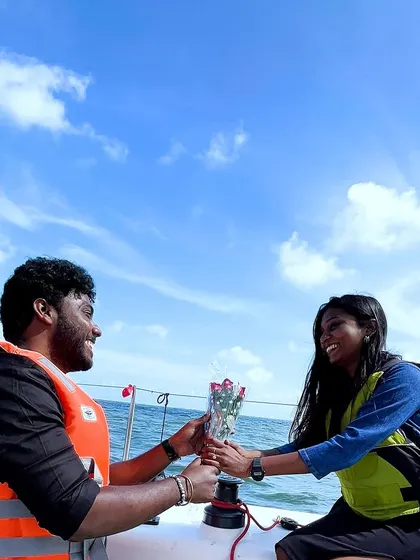 The groom-to-be presenting his fiancée with a bouquet of roses on the yacht. We can include flowers, cake, and other romantic touches to the package.
