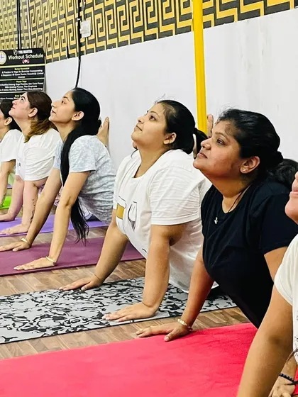 A close-up of the focus and effort during our Power Yoga class. Every breath and every movement counts towards your wellness journey.