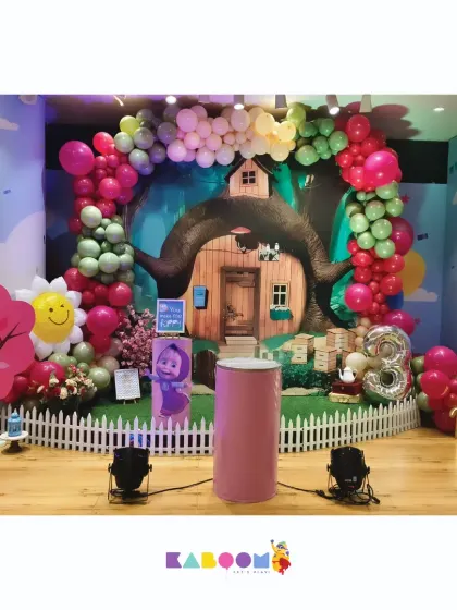 A whimsical adventure with Masha and the Bear. This enchanting forest setup features a treehouse backdrop, colorful balloons, and the beloved characters.