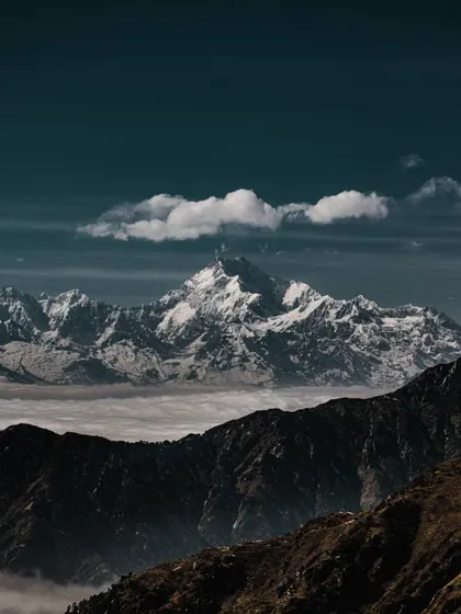 snow-capped mountains floating above a sea of clouds. the clean separation between elements here is a great reference for creating clear, organized layouts.