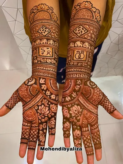 I did this beautiful engagement henna for my best friend. It features her and her partner's initials, along with lotus and elephant motifs for good luck.