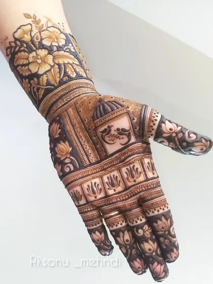 This design showcases a stunning floral cuff on the wrist. The bold, dark background makes the flowers pop, creating a dramatic and beautiful statement piece.