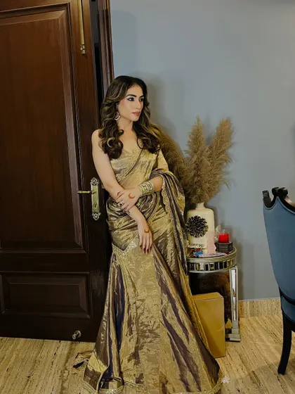 Another angle of my self-designed gold tissue saree from my brother's wedding. The texture of the fabric is the real hero of this outfit.