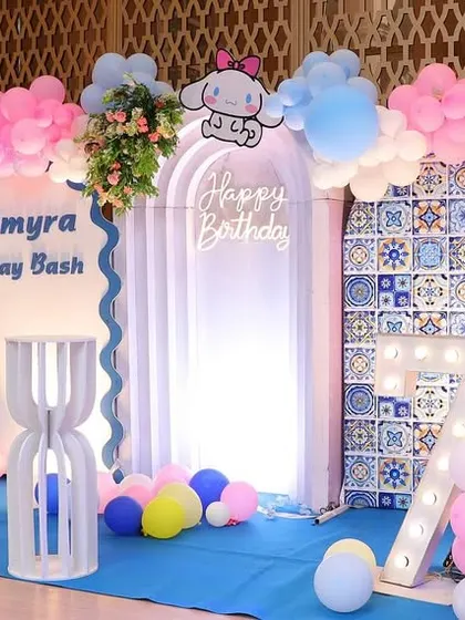 Another view of the Kuromi and Hello Kitty birthday setup, showing the full balloon arch and character placements.