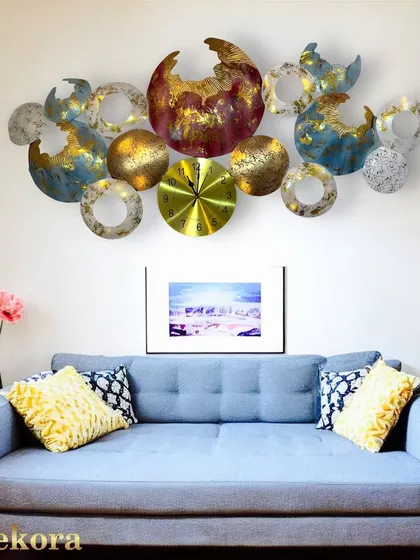 An abstract wall clock that doubles as a sculpture, featuring colorful, textured orbs and rings. It's a piece of modern art that also tells time.