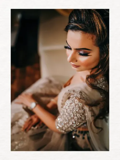 A close-up shot focusing on the bride's stunning makeup and the detailed sequin work on her outfit. We highlight the craftsmanship that goes into the bridal look.