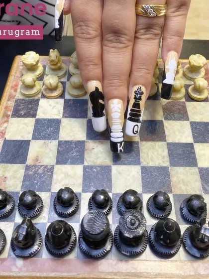 This image shows the nails interacting with a real chessboard, bringing the concept to life.