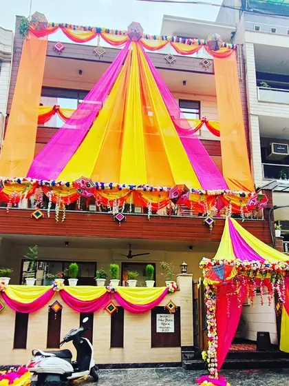 A full view of the grand house decoration, showcasing the multi-level draping and the beautifully decorated entrance tent.