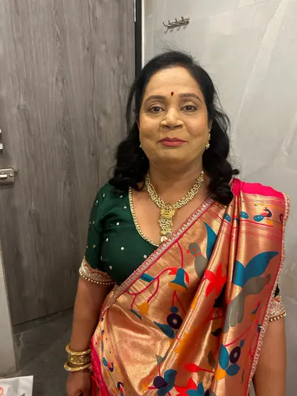 Another shot of the bride's mom. The makeup is natural and enhances her warm smile.