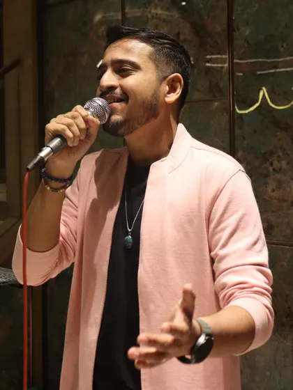 A candid shot while singing, completely absorbed in the melody. These are the moments of pure musical flow.