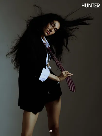 An inside spread for Hunter Magazine. This shot captures a moment of effortless cool, using a single light source to create a moody, high-fashion feel.