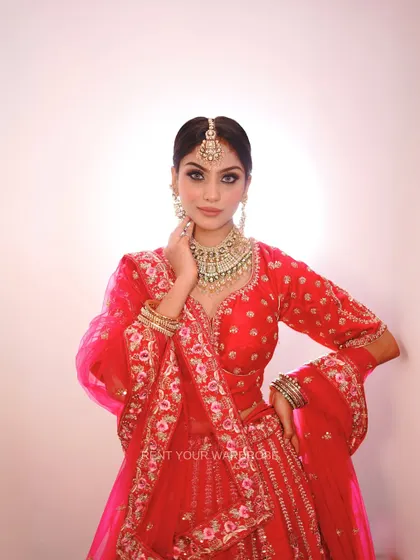 A close-up of our red and pink floral embroidered lehenga, a dreamy and romantic choice.