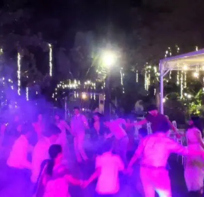 The party is in full swing, with smoke and purple lights creating a great vibe.