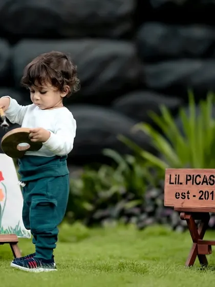 Another little artist hard at work, painting his masterpiece. We love capturing their focus and concentration during themed shoots.