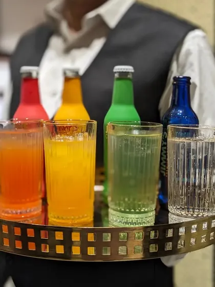 My staff serving a colourful array of cocktails and mocktails at a Paul Smith event, a collaboration with Jimmy's Cocktails.