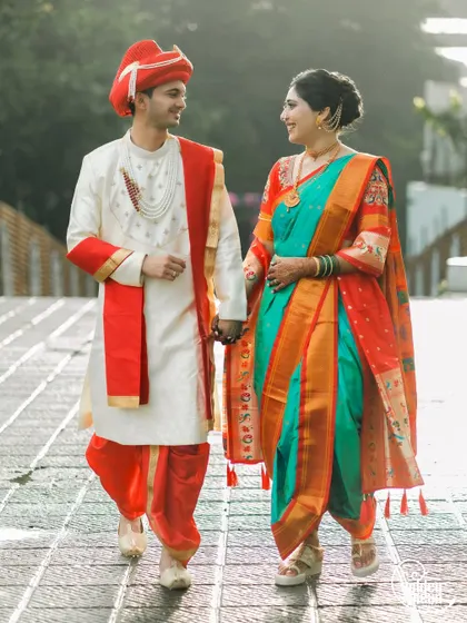 Embracing tradition with a vibrant Maharashtrian pre-wedding shoot. We love the energy of couples in full traditional attire, like the classic dhoti, pheta, and nauvari saree, walking hand-in-hand into their future.