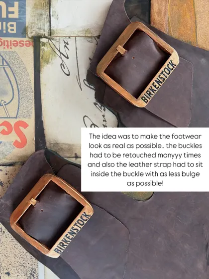 A close-up of the finished installation, showing the custom-made wooden buckles and the texture of the real leather strap. The goal was to make it look as realistic as possible.