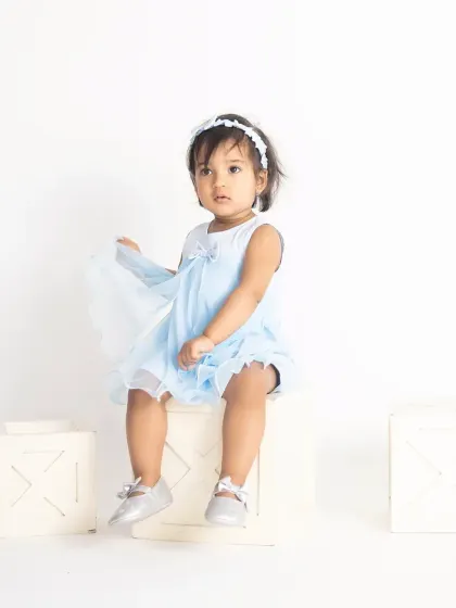 Those innocent eyes. We use simple, bright lighting to create these pure and classic portraits that focus entirely on your child.