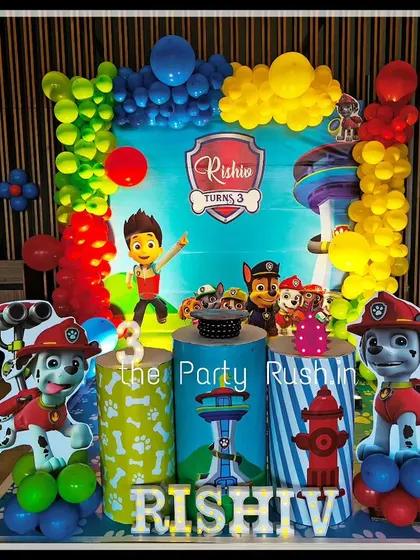 Rishiv's third birthday was a "paw-some" event with this Paw Patrol theme. The decor features cutouts of Marshall and Chase, a themed backdrop, and colorful balloon arrangements representing the heroic pups.