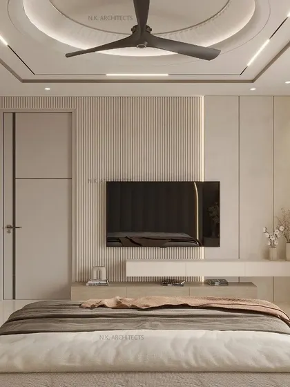 The TV wall in the arched bedroom. The design uses simple, clean lines and fluted paneling to complement the arched headboard, maintaining a warm and subtle vibe throughout the room.