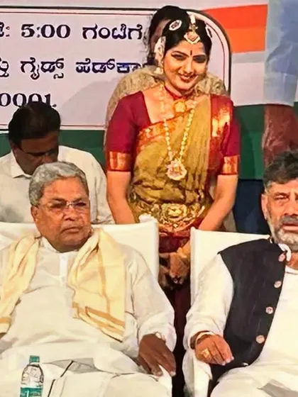 Standing on stage with the Chief Minister and Deputy Chief Minister of Karnataka. It is a privilege to represent the art of Bharatanatyam at such esteemed gatherings.
