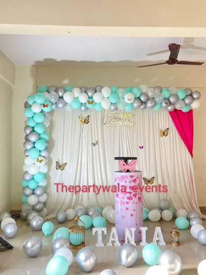 A lovely butterfly theme with a mint green and silver color palette, creating a fresh and modern look.