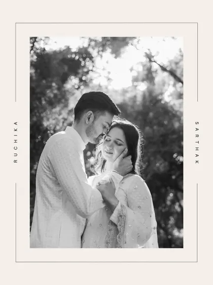 A classic black and white portrait of a couple, framed with their names, exuding timeless elegance.