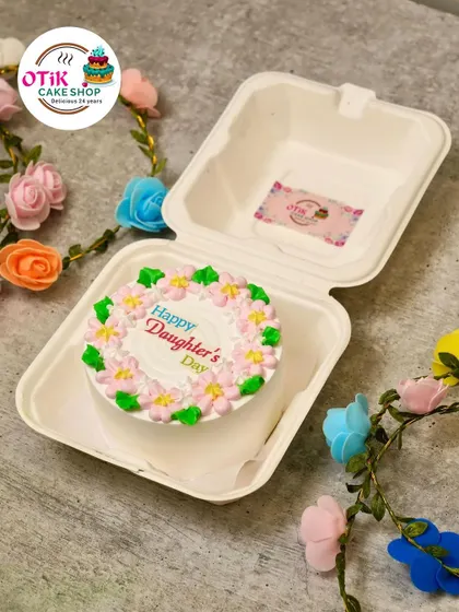 A floral bento cake for Daughter's Day, with a ring of delicate pink and yellow flowers. It’s a beautiful and fresh design to celebrate your special girl.