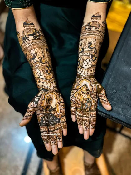 Another angle of Lavanya's divine wedding mehendi, showing the beautiful flow of the design from the palms to the arms.