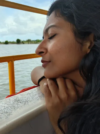 A quiet, contemplative moment on a boat. This close-up lifestyle shot captures a serene and natural expression, showing my softer side.