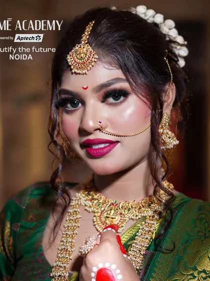 A close-up of a traditional Bengali bridal look. We teach the iconic elements, including the bold red bindi, white mukut, and intricate chandan designs on the forehead.