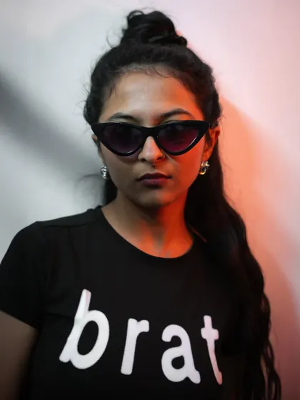 A direct, confrontational pose with bold red-orange lighting. This portrait showcases my ability to convey a strong attitude for fashion and editorial work.