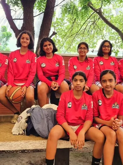 Our U13 girls team representing MCHS club, taking a moment before their game at the Karnataka State U13 Sub Junior championship.