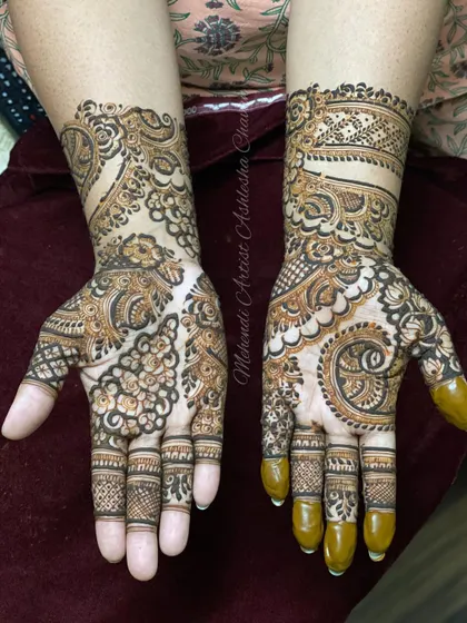An Indo-Arabic design with a mix of bold and fine lines. The patterns are intricate and create a rich, textured look.