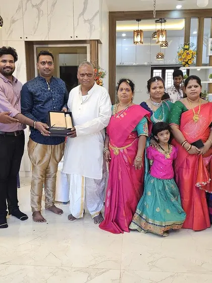 Our team celebrating with a client and their family during a housewarming ceremony. These relationships are the foundation of our success.