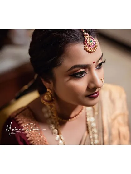Another beautiful portrait of Ashwini, highlighting her classic winged eyeliner and rich lip color.